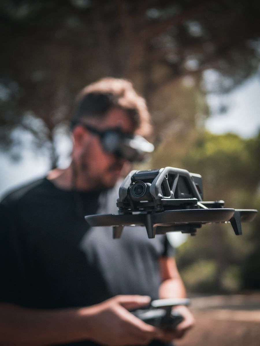 Pilot holding an FPV drone